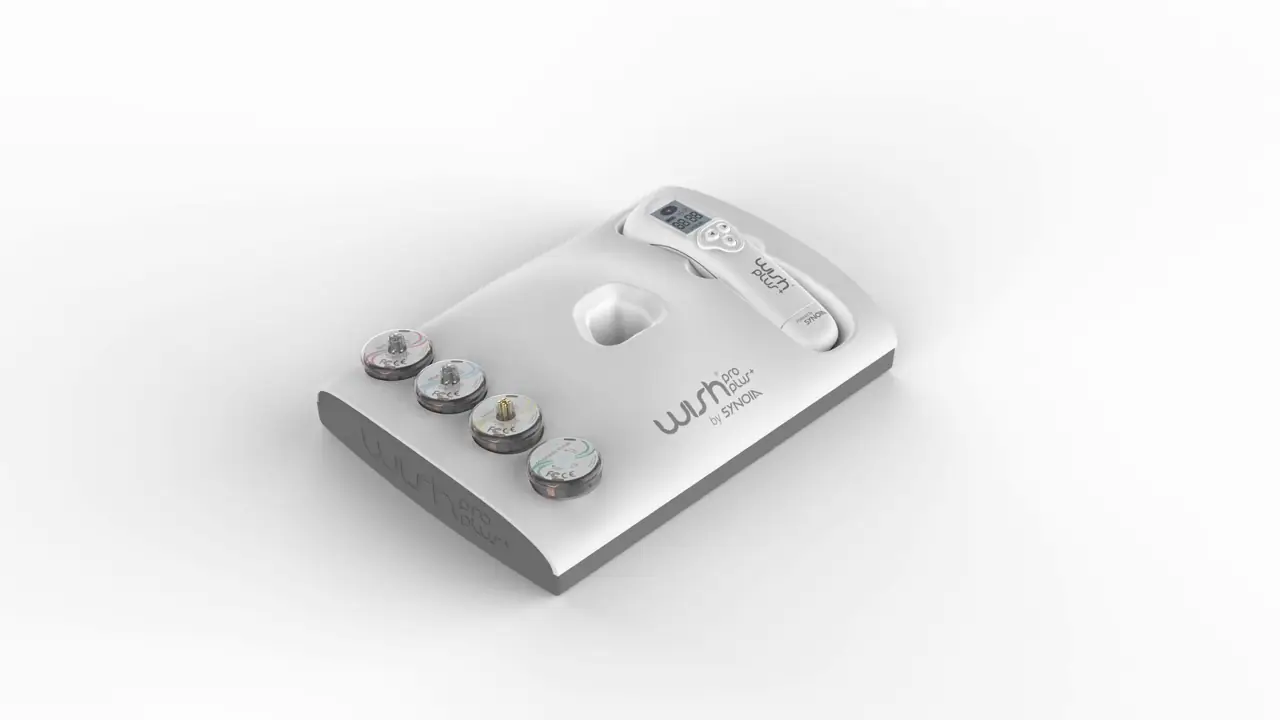 A 3D render of the WISHpro console, with the handpiece and all four technology heads